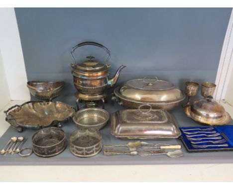 A selection of silver plated items including entree dishes, teapot on stand with burner, coasters, spoons etc.