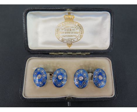 A pair of late 19th/early 20th century gold diamond and enamel cufflinks - Each blue and gold enamel panel set with an old-cu