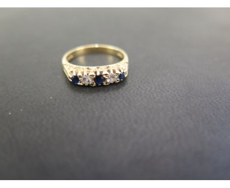 An 18ct gold sapphire and diamond ring - Hallmarked London - Ring size M 1/2 - Weight approx 4.0gms
Condition Report: Good - 