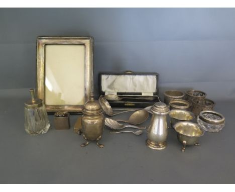 A selection of hallmarked silver items including Photograph/picture frame, napkin rings, peppers, inkwell, twin sovereign hol