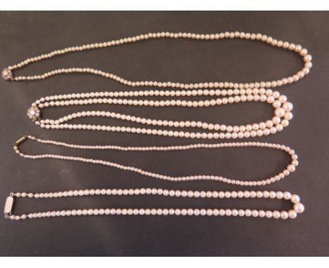 A single row and a double row cultured pearl necklace - Lengths 43 and 40cms - Together with two imitation pearl necklaces 
C