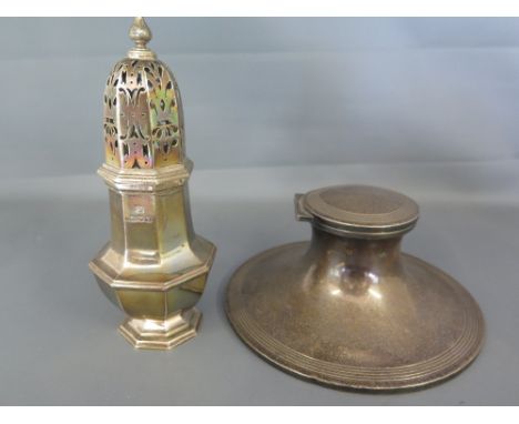 An Edwardian hallmarked silver Capstan inkwell - Birmingham 1910 - 11 and a hallmarked silver sugar sifter - London 1911 - 12