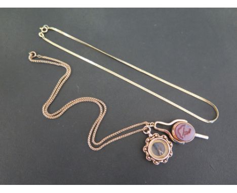 A 9 ct gold Compass watch fob together with a yellow metal swivel watch fob and key with bloodstone and intaglio seal - not h