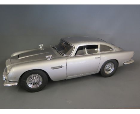 A 1:8 scale model of the James Bond - Goldfinger - Aston Martin DB5 - kit built, constructed from mainly metal parts, origina