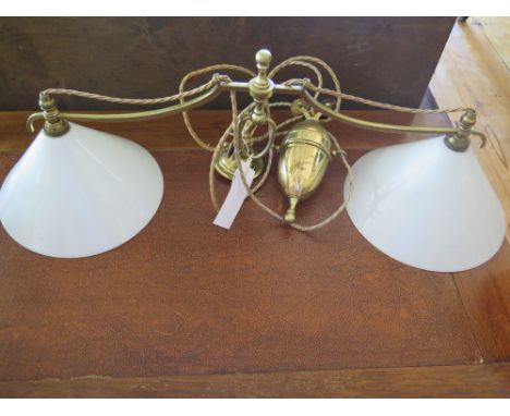 A brass twin shade rise and fall lamp
Condition report: In good clean condition  