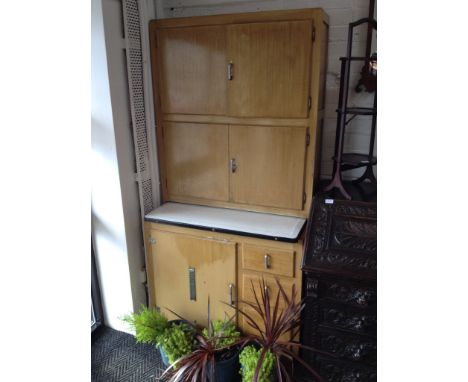 An Art Deco Hygena grained wood kitchenette with enamel slide and aluminium handles, the top cupboards with Hygena charts, wi