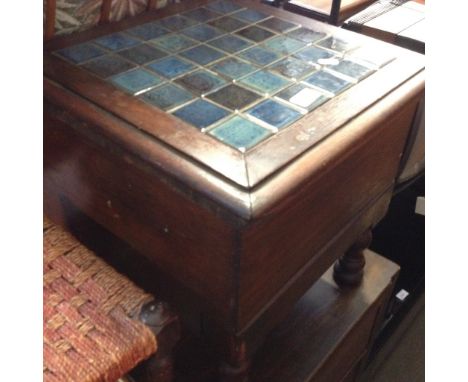 A TILED TOP COMMODE
