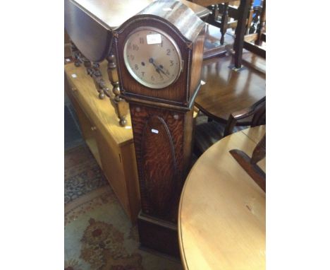 AN OAK GRANDAUGHTER CLOCK