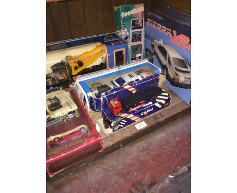 SHELF OF BOXED MODEL VEHICLES