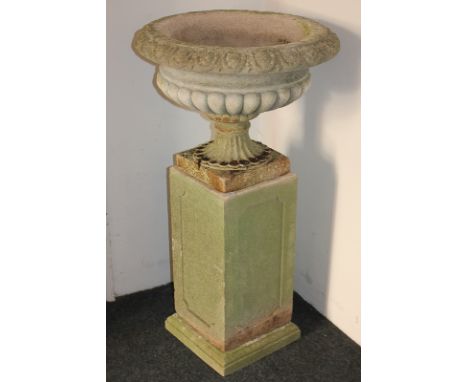 A composition garden urn planter on square base, 60cm, together with a square composition garden plinth, 53cm by 28cm