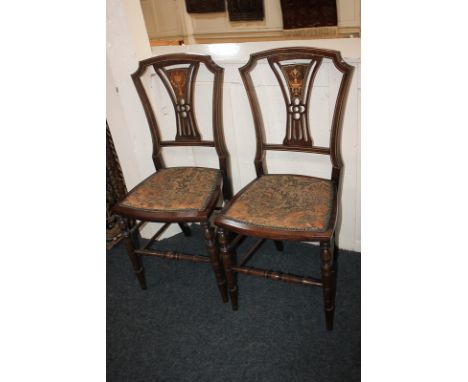A pair of Victorian inlaid drawing room chairs with pierced splats decorated with central vase panel, tapestry upholstered se