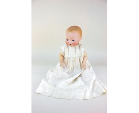 An Armand Marseille bisque head Dream-Baby doll, with sleeping blue eyes and open mouth, marked A.M. Germany 351./4.K., on jo