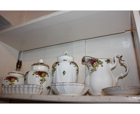 A large collection of Royal Albert Old Country Roses pattern porcelain including a lamp base, two jugs, two jars and covers, 