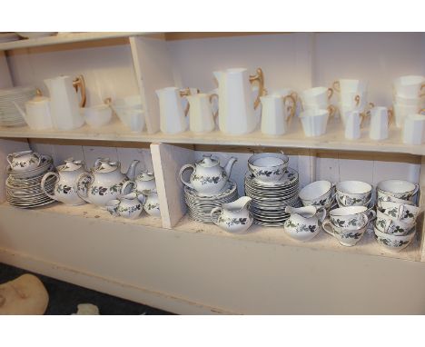 A Royal Doulton Burgundy pattern part tea service to include two large and two small teapots, cream jugs, side plates, variou