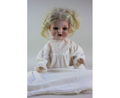A Heubach Kopplesdorf bisque head doll with blonde wig, sleeping blue eyes and open mouth, marked Heubach Kopplesdorf 342.4 1