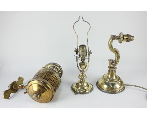 Three brass light fittings to include a  gimballed ship's lamp, 22.5cm, and a wall lamp with scroll stem, 30cm, (a/f)