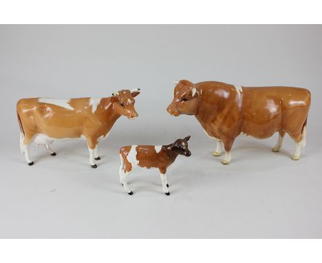 Three Beswick porcelain models of Guernsey cattle, bull CH Sabrinas Sir Richmond 14th (1451), cow First Version (1248A") and 