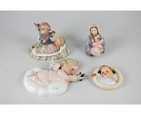 A collection of four Goebel and Hummel figures and plaques including a mother and child, a cherub overlooking a swaddled baby