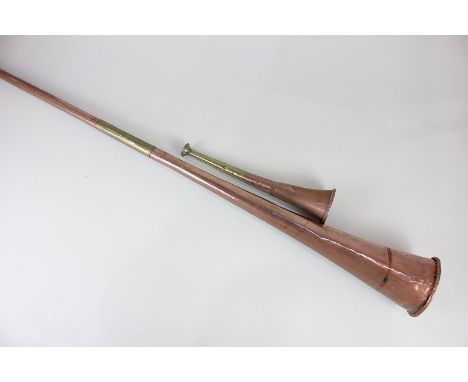 Two copper and brass hunting horns of tapering circular form, longest 114cm