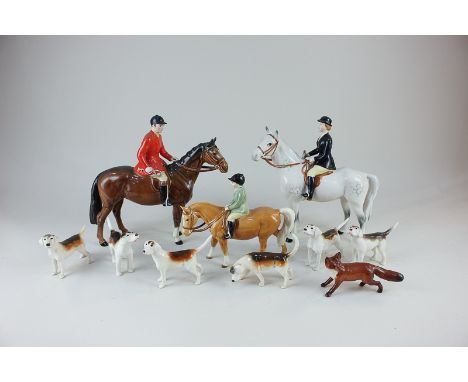 A Beswick porcelain hunting group including huntsman on brown horse (1501), huntswoman on grey horse (1730), boy on pony, six