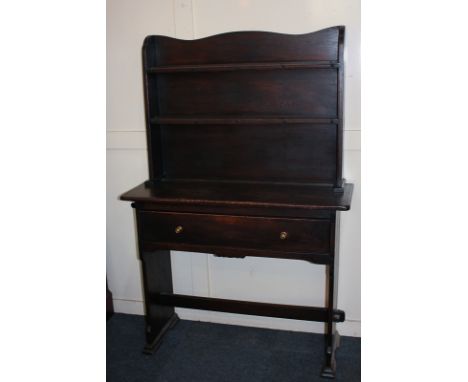 A stained oak dresser with shelf rack back above base with single drawer, on end supports with tusk tenon jointed stretcher, 