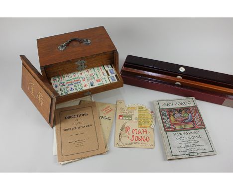 A bone and bamboo Mahjong set in wooden fitted case, together with a box of tile rests. a Chad Valley score card and calculat