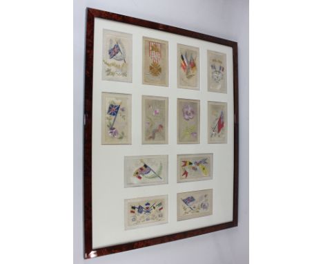 A collection of twelve First World War silk embroidered postcards, in glazed frame, frame measures 61cm by 50cm