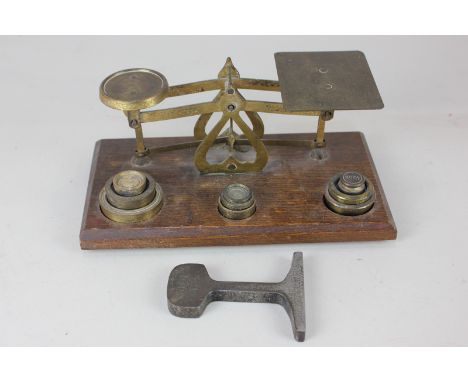 A set of Victorian brass postal scales with assorted weights, 20cm