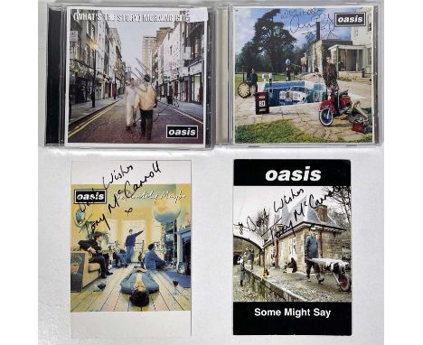 A CD copy of Oasis - Be Here Now signed to front of CD booklet by Guigsy, to Oasis Information Network booklet by Liam and to