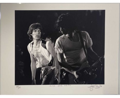 A limited edition print of an image by photographer John Rowlands depicting Mick Jagger and Keith Richards onstage , 1977. Si