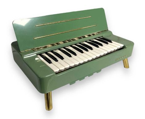 A c 1958 Hohner Organetta. Powers on and appears in full working order.
