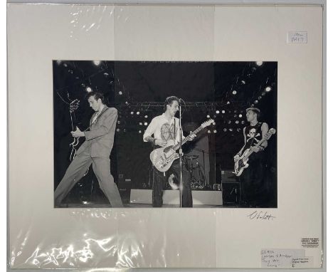 The Clash, a 20x16" digital print of The Clash, live at the Rainbow Theatre, July 1979. Signed by the photographer Virginia T