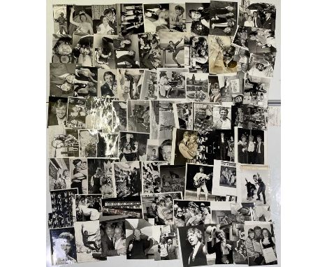 Two folders with approx 183 variously sized (many c 8x10") black and white press photographs depicting Tommy Steele, many vin