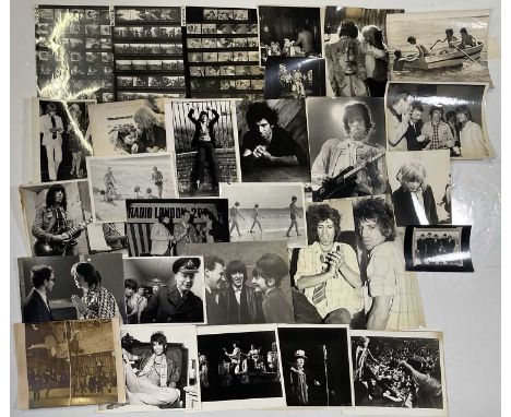 29 variously sized (most c 8x10") press photographs depicting the Rolling Stones, most c 60s/70s printings, many with press/p