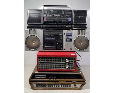 A collection of vintage radio/cassette players and portable record players to include: a BSA portable record player, an Autom