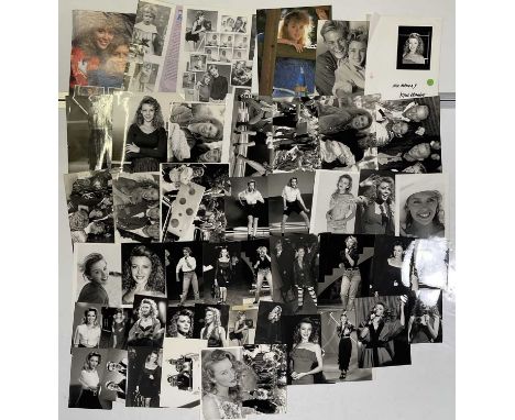 Approx 42 variously sized (many c 8x10") black and white press photographs depicting Kylie Minogue, many vintage prints with 