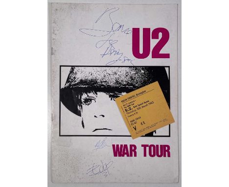 A 1983 U2 'War Tour' programme signed to front cover in blue ink by Bono, The Edge, Adam Clayton. Obtained in person by the v