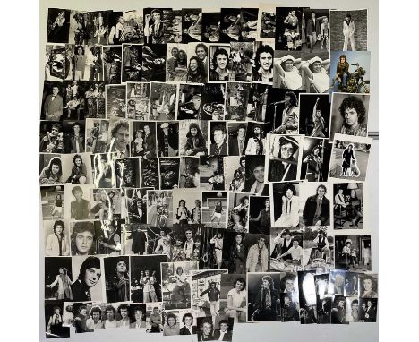Approx 155 variously sized (many c 8x10") black and white press photographs depicting David Essex, many vintage prints with p