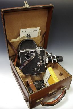 A Paillard Bolex H8 cine camera with three lens carousel in original leather case