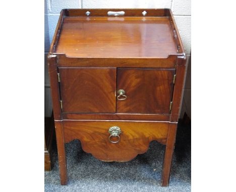 A George III mahogany step commode, tray top over two door cupboard.
