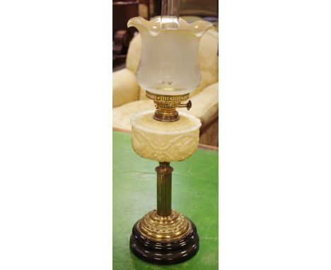 A Victorian oil lamp, frosted shade, opaque reservoir, reeded column Duplex burner.