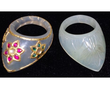 A Chinese celedon jade archers ring;  another 
