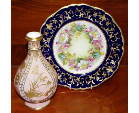 A Cauldon  limited shaed circular cabinet plate ainted by S.Pope with a chaplet of dog roses against a mottled yellow ground,