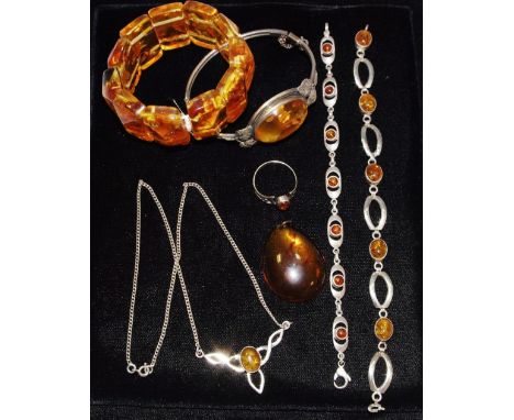 Amber Jewellery - a sliver mounted bangle; various bracelets; pendant; etc 