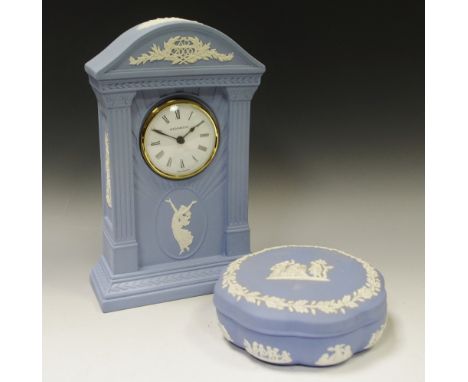 A Wedgwood blue jasper mantel clock, sprigged in white, 22cm high;   a similar trinket dish (2