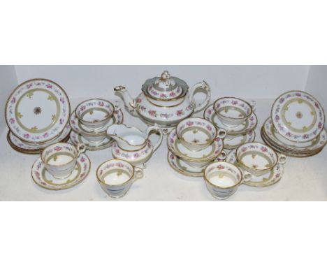 An early 19th century tea service, comprising teapot, seven large cups, four smaller cups, eight saucers, seven side plates, 