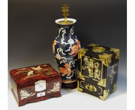 An oriental black lacquered jewellery cabinet; another; a Drontel lamp (3\)