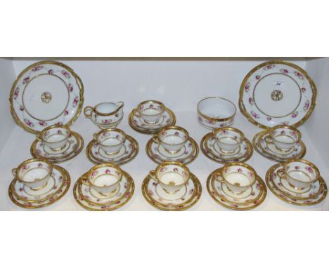 A Noritake tea service, gilded and roses border, comprising teacups &amp; saucers, side plates, milk jug, sugar bowl and two 