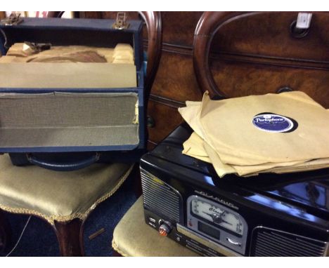 A 'Classic' record player and radio together with a selection of Parlophone speed 78 records.