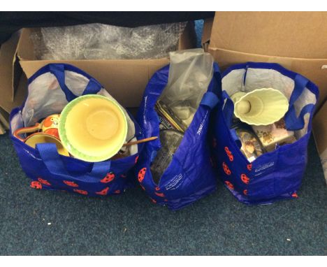 Three bags of household items including salt and pepper cellars, ceramic pots, decorative tins, a pond yacht, and glass pots